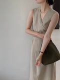 Kukombo's main person wears V-neck cross strap waist slim dress female commuting temperament long skirt 6055