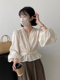 Kukombo Qiuxu ~ Gentle twisted waist lantern sleeve shirt female 2023 autumn new V-neck French shirt 169