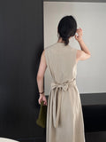 Kukombo's main person wears V-neck cross strap waist slim dress female commuting temperament long skirt 6055